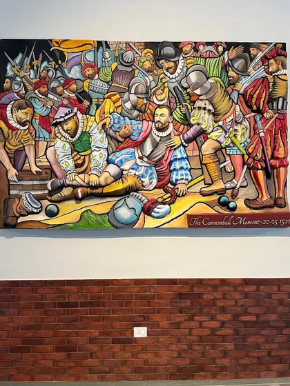 The final, painted "Cannonball Moment" mural installed on a brick-patterned wall. The vibrant, storybook colors bring the historical scene to life.