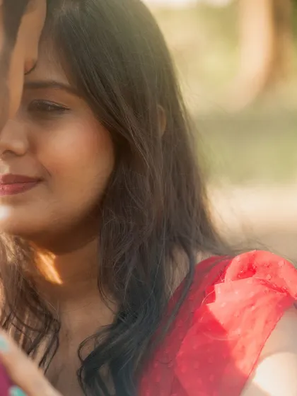 A soft-focus, intimate close-up of the bride-to-be during her pre-wedding shoot. The gentle light and her serene expression create a beautifully romantic portrait.