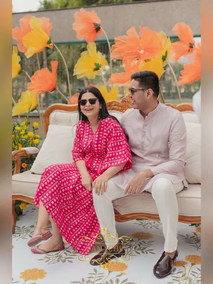 A candid moment of laughter between the couple during their Haldi photoshoot.