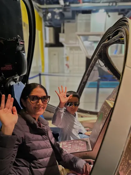 Waving from the cockpit of a jet at the Intrepid Museum. These moments of playful exploration are where some of the most lasting memories and learning connections are made.
