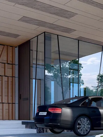 This angle shows the interplay between the solid stone-clad volumes, the transparent glass walls, and the textured wooden elements of the Goa residence. The design is a complex composition of materials and forms.