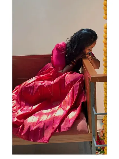A thoughtful moment captured. This image shows the soft drape of the upcycled fabric and how the dress flows, creating a truly dreamy and personal piece.