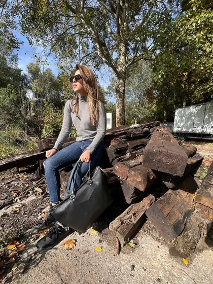 Taking a break on set. Even in a simple turtleneck and jeans, I always want to feel put-together.