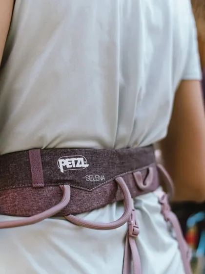 A close-up of a Petzl Selena harness, specifically designed for a woman's body. We prioritize providing gear that is comfortable and fits well.