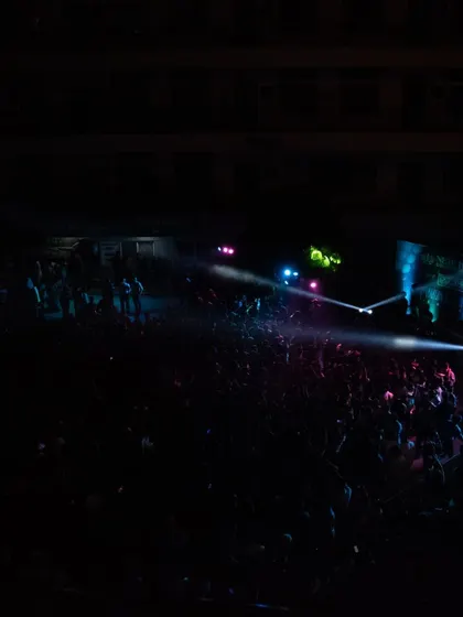 A wide shot of the outdoor stage and crowd at New Horizon College, showing the scale of their Diwali Night celebration.
