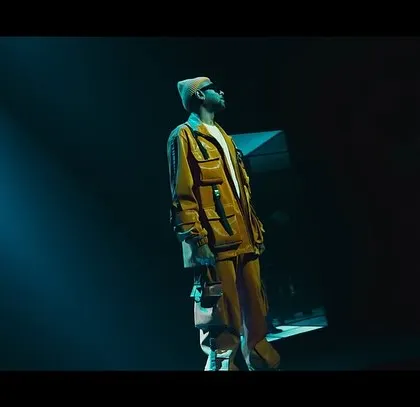 A dramatic shot of singer Benny Dayal from the BGMI music video. The custom yellow jacket and futuristic styling were designed to match the high-energy, gaming aesthetic.
