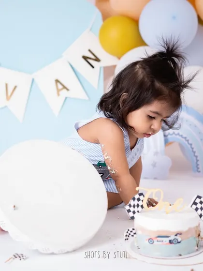 The cake stand has been toppled! I embrace the chaos because it results in authentic, action-filled shots that truly represent the energy of a one-year-old.