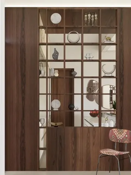 Elegance in the form of a partition. This dark wood grid shelf acts as a semi-transparent divider, separating spaces while allowing light and views to pass through. It's a functional piece that doubles as a display for art and ceramics.