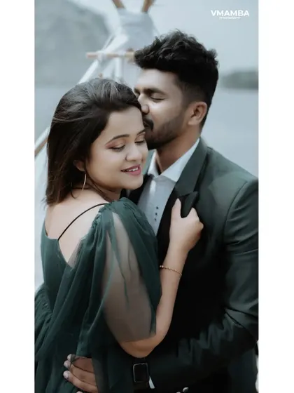 A tender kiss on the forehead. This classic, romantic pose is a beautiful way to capture the love and affection in a pre-wedding portrait.