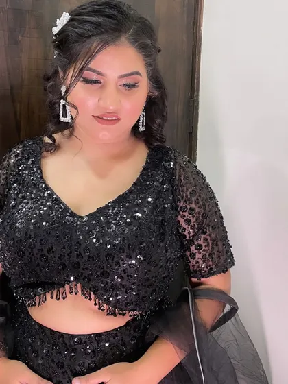Another angle of the makeup, showing the beautiful shimmer on her eyelids and the flawless base.