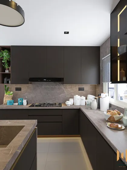 A view of the main cooking area, with a gas hob and ample counter space, all unified by the luxurious granite.