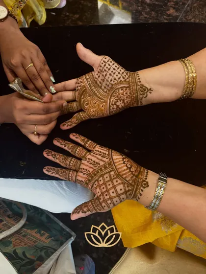 An in-process shot of a guest mehendi application. We use 100% organic henna, ensuring a safe and pleasant experience even for guests with sensitive skin.