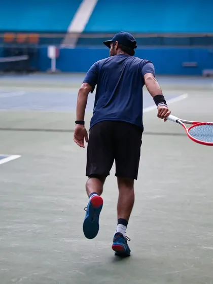 Walking onto the court with purpose. Every session starts with a clear goal, whether it's improving your serve or mastering your footwork.