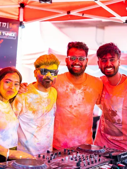 Covered in colors and good vibes at the Holi 2k24 festival. Posing with friends behind the decks during a fun-filled day.