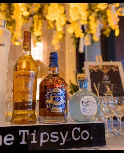 A premium bar display featuring top-shelf spirits like Glenmorangie and Don Julio. The setup is clean and sophisticated, letting the quality of the liquor speak for itself.