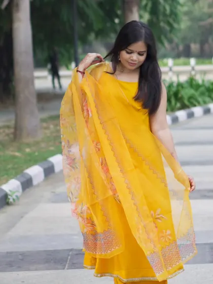 A three-quarter shot showing the model interacting with her outfit. This is a great way to showcase clothing in a fashion portfolio.