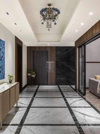 A lobby we designed that embodies our commitment to luxury. The fluted credenza with its marble top and the surrounding wall paneling were all crafted by us to create a sophisticated and welcoming entrance.