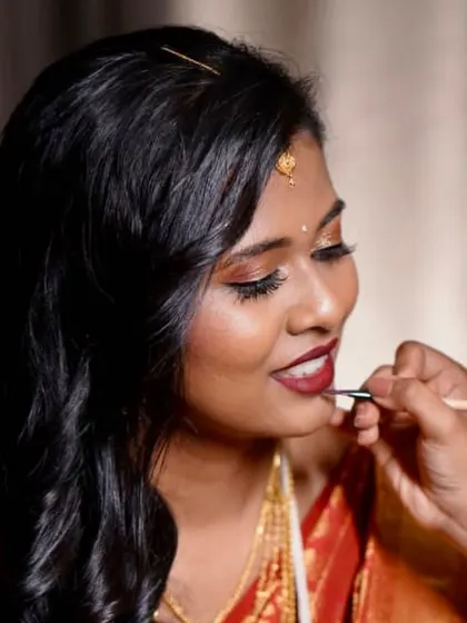Another angle of me applying the lipstick. Precision and care go into every step of the process.