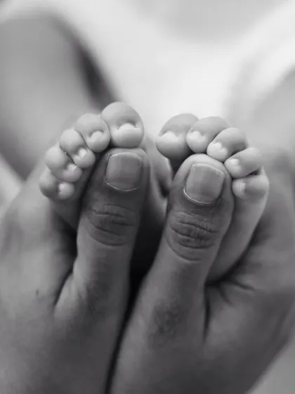 They won't be this little forever. A close-up of your baby's tiny feet held in your hands is a powerful reminder of these fleeting first few weeks.