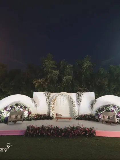 Another angle of the unique wave-like floral backdrop, demonstrating its scale and the beautiful texture created by the dense flowers.
