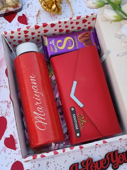 A simpler but equally beautiful Valentine's combo for her. This set includes a personalized red sparkle flask, a custom 3-fold ladies clutch, and a Cadbury Silk chocolate, all in a gift box.