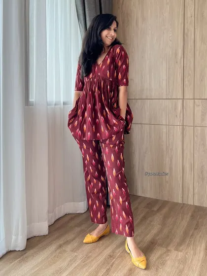 This maroon Ikat co-ord set is all about breezy, beautiful style. The peplum top and matching pants are crafted from handloom Ikat, making it a chic and comfortable choice for warm days.