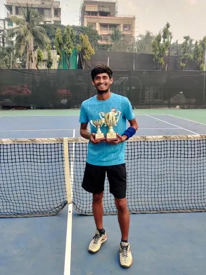 Coach Mangesh Iname with his trophies from the Coaches Tournament. His success is an inspiration to all our players at the academy.