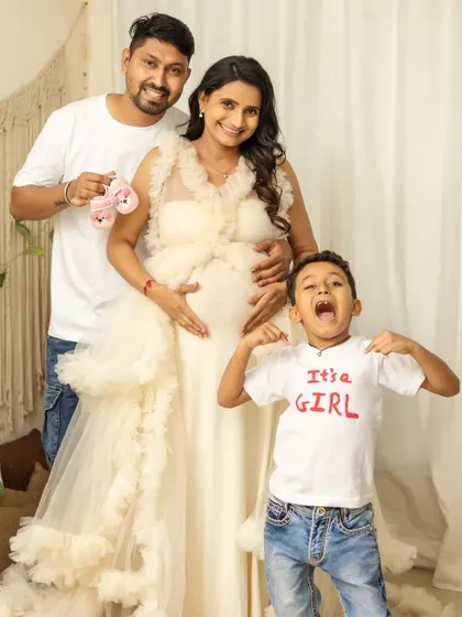 It's a girl, and the big brother's excitement is contagious. This is a perfect family announcement photo, full of energy and happiness.