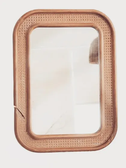 Our rectangular rattan mirror is framed with detailed cane weaving, adding a touch of bohemian elegance to any room. It's perfect for entryways, bathrooms, or as a decorative accent in a living space.