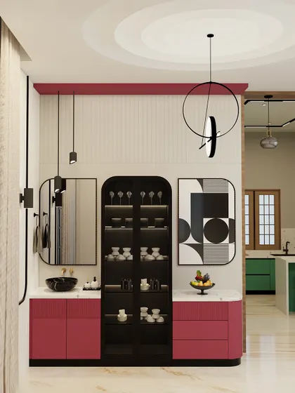 This crockery and bar unit was designed to be a statement piece. The bold magenta, balanced with white fluted panels and a quartz countertop, creates a vibrant look. I added custom abstract art and suspended lights to complete this modern and functional corner.