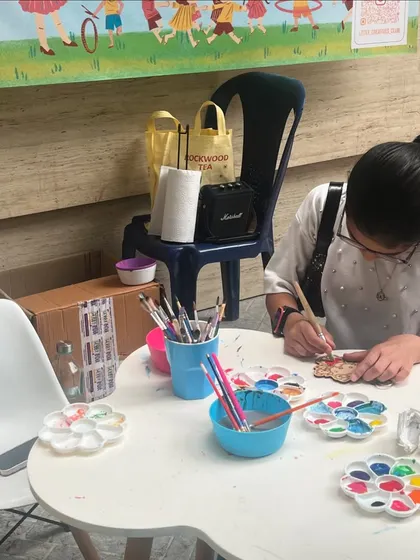 A look at our setup. We bring everything needed for a complete art experience, including kid-friendly tables, chairs, and a wide array of supplies.