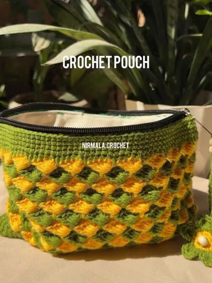 The same textured pouch design, shown here with a sturdy zipper and a beaded tassel.
