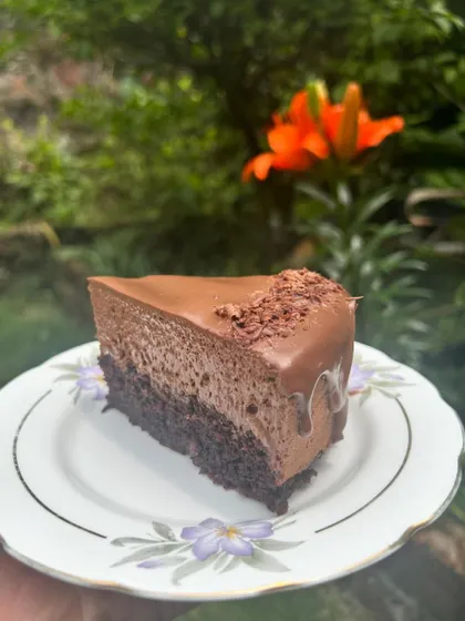 Another beautiful slice of the triple chocolate mousse cake, ready to be enjoyed.