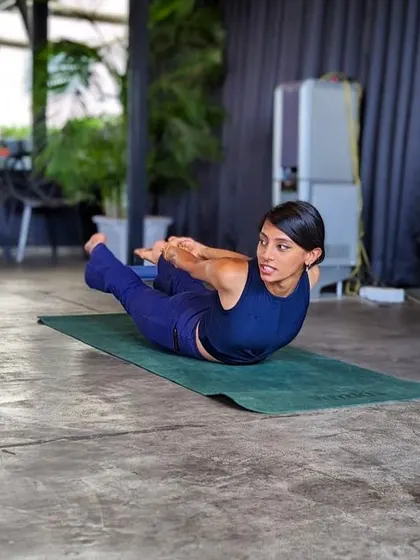 Demonstrating a pose while a puppy observes. Dogs and yoga both teach us to love without judgment, and combining them is pure magic.