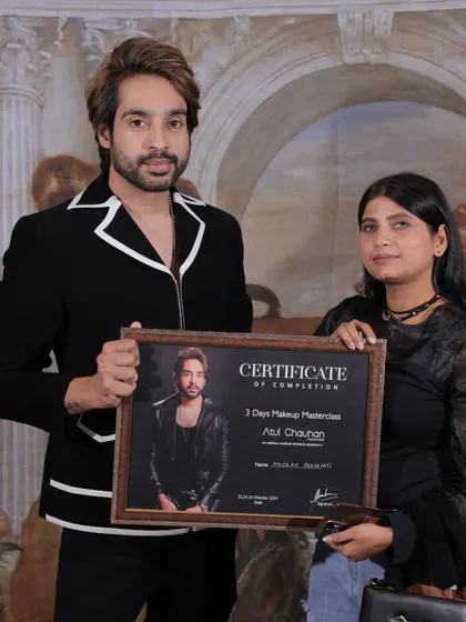 Awarding a certificate to another successful student. Her passion for makeup was evident throughout the course.