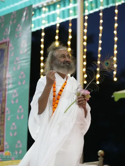 A joyful moment during the Janmashtami satsang. The celebration of Krishna's birth is a time for singing, dancing, and experiencing the divine love that he represents.