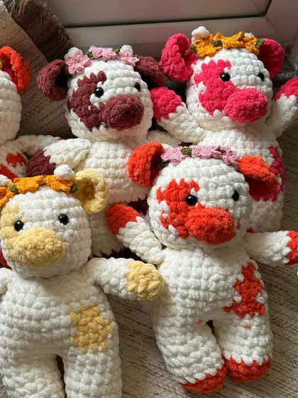 A closer look at the variety within our crochet cow collection. The different colored patches and flower crowns make each one unique. These are handmade with soft, plush yarn, making them extra cuddly.
