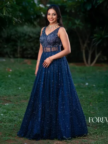 The full view of this sparkling blue gown shows its flattering A-line silhouette and the all-over katdana embroidery that catches the light with every movement. A true showstopper for any formal event.