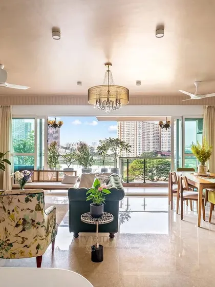 In our 'Tatvam' project, we made a bold choice to paint the ceiling a neutral blush pink. This decision filled the mid-century modern living room with a rich hue and unexpected warmth, making the entire space feel cohesive and inviting.