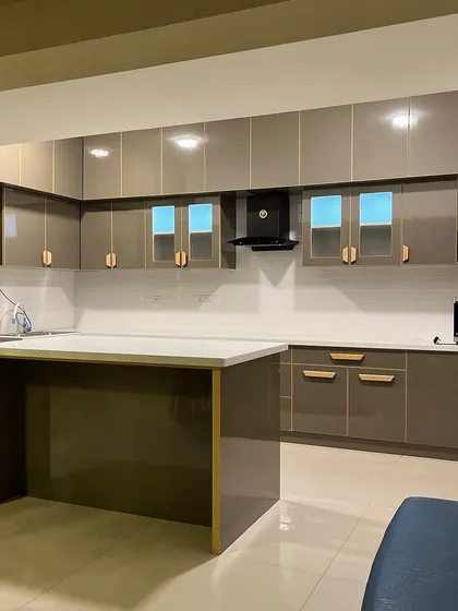 Another angle of our budget-friendly luxury kitchen, showing the island and ample storage. We believe in creating beautiful homes you can also afford to live in.