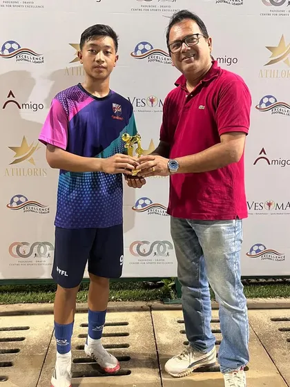 Arnold receiving his second Player of the Match trophy for his performance against Raman FA. Consistency is key to development.