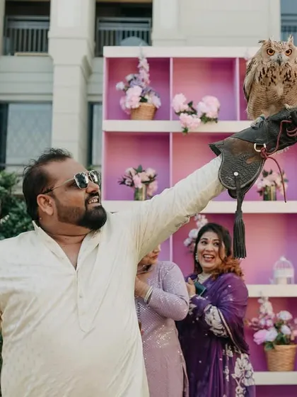 Guests enjoying the unique falconry experience, a personal touch that made this Dubai destination wedding even more memorable.
