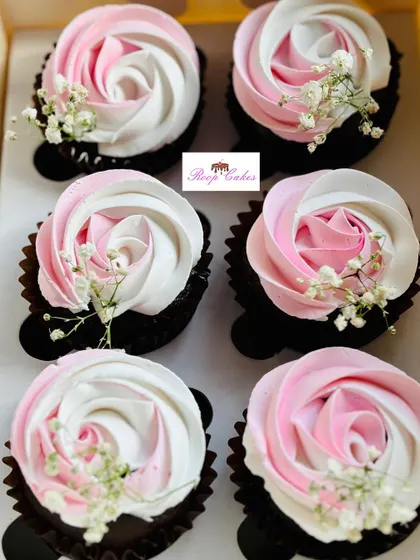 A beautiful set of cupcakes for a bride-to-be. I created these elegant two-toned frosting roses in pink and white on rich chocolate cupcakes, and finished them with a delicate sprig of baby's breath.