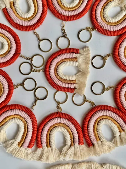Another view of my handmade rainbow keychains, showing the warm color palette of red, pink, and gold. These are a favorite for birthday party return gifts.