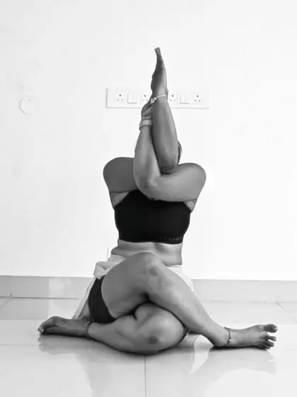 This is a variation of Gomukhasana, or Cow Face Pose, with Eagle arms. The pose combines a deep hip-opening stretch with a shoulder-opening bind, creating space in two major areas of tension.