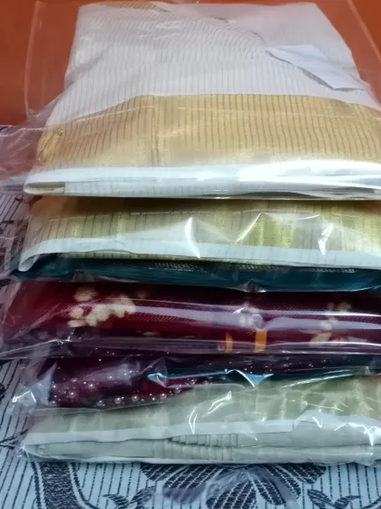 A stack of sarees, all pleated, packed, and ready to go back to a happy repeat client. I take pride in being a trusted partner for women who want to look their best for every occasion, big or small.