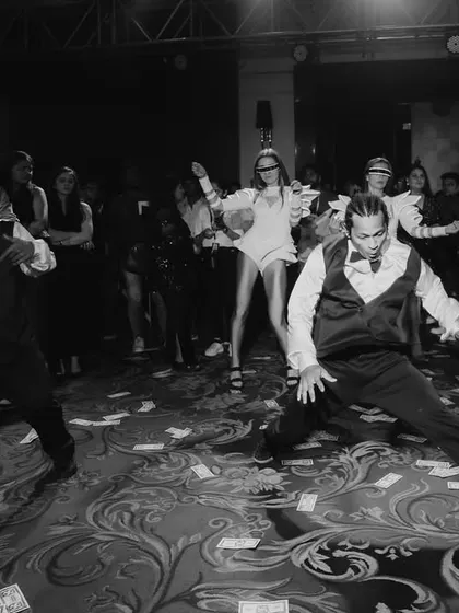 The dance floor is alive with energy as performers showcase their skills, creating a dynamic and engaging atmosphere for all the guests.