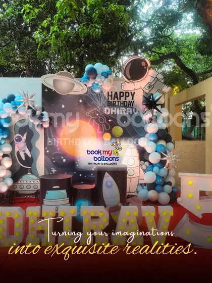 We turned Dhirav's fifth birthday into an intergalactic mission with this space theme. The outdoor setup featured a large astronaut cutout, a planet-filled backdrop, and marquee letters spelling out his name under the stars.