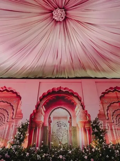 We brought the grandeur of Rajasthani palaces to this Sangeet stage. The backdrop features intricate arches inspired by Jaipur architecture, creating a royal and traditional setting for the pre-wedding celebration.