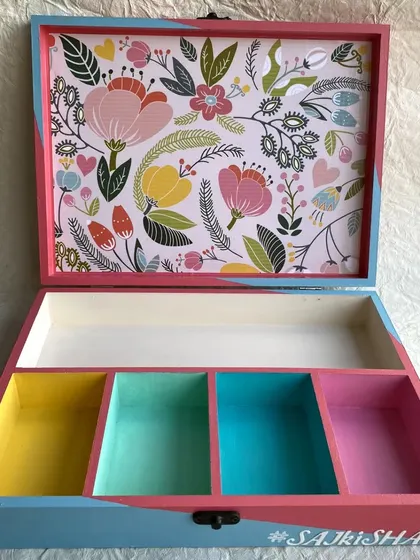 The inside of the bridal gift box has colorful compartments and a matching floral print on the lid.